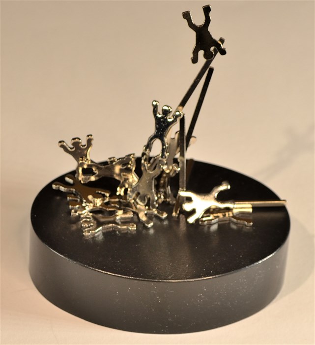 Metal acrobats on a strong magnet