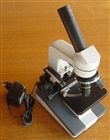 Microscope with mechanical board, LED, battery and charger